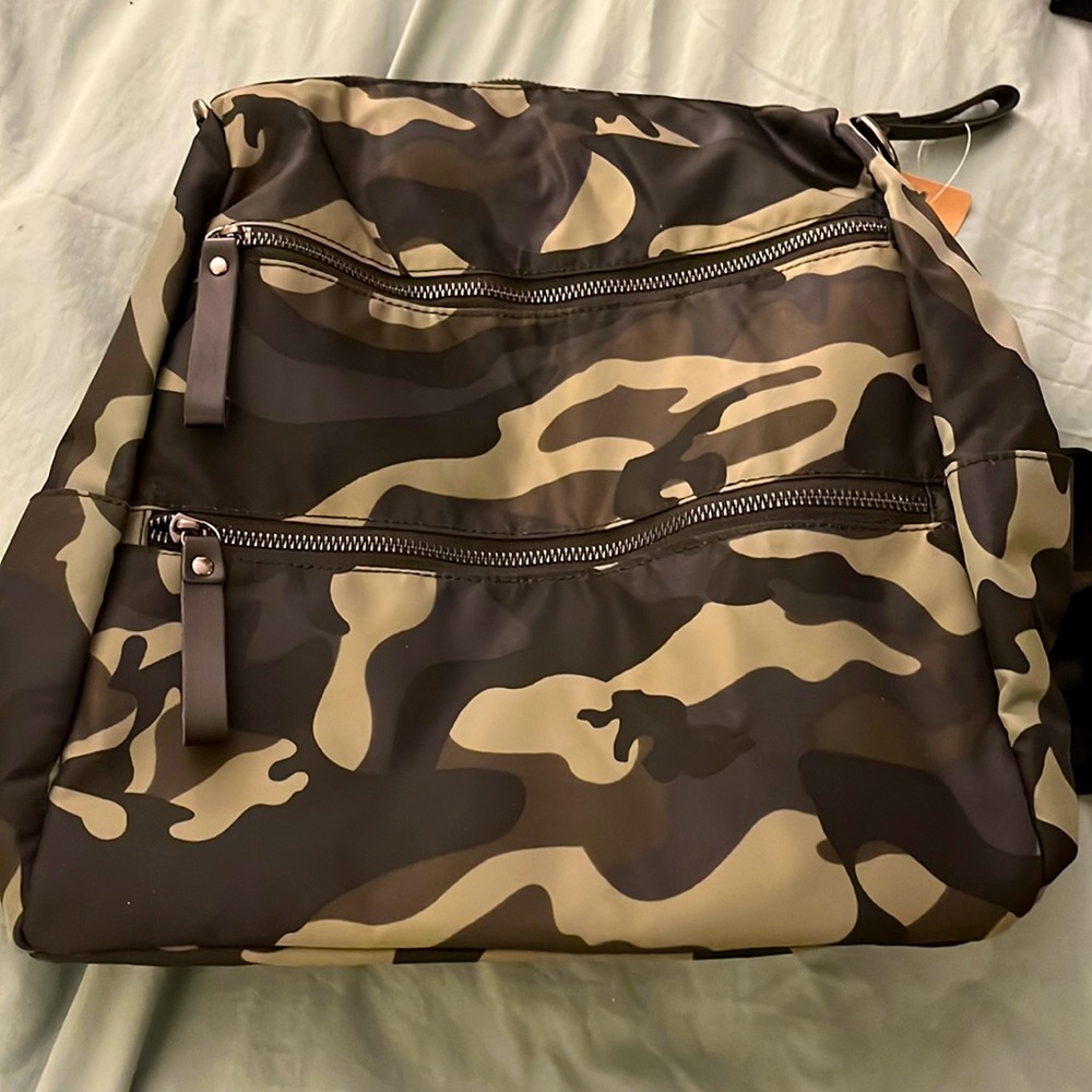 Camouflage water resistant backpack. Lots of pockets!